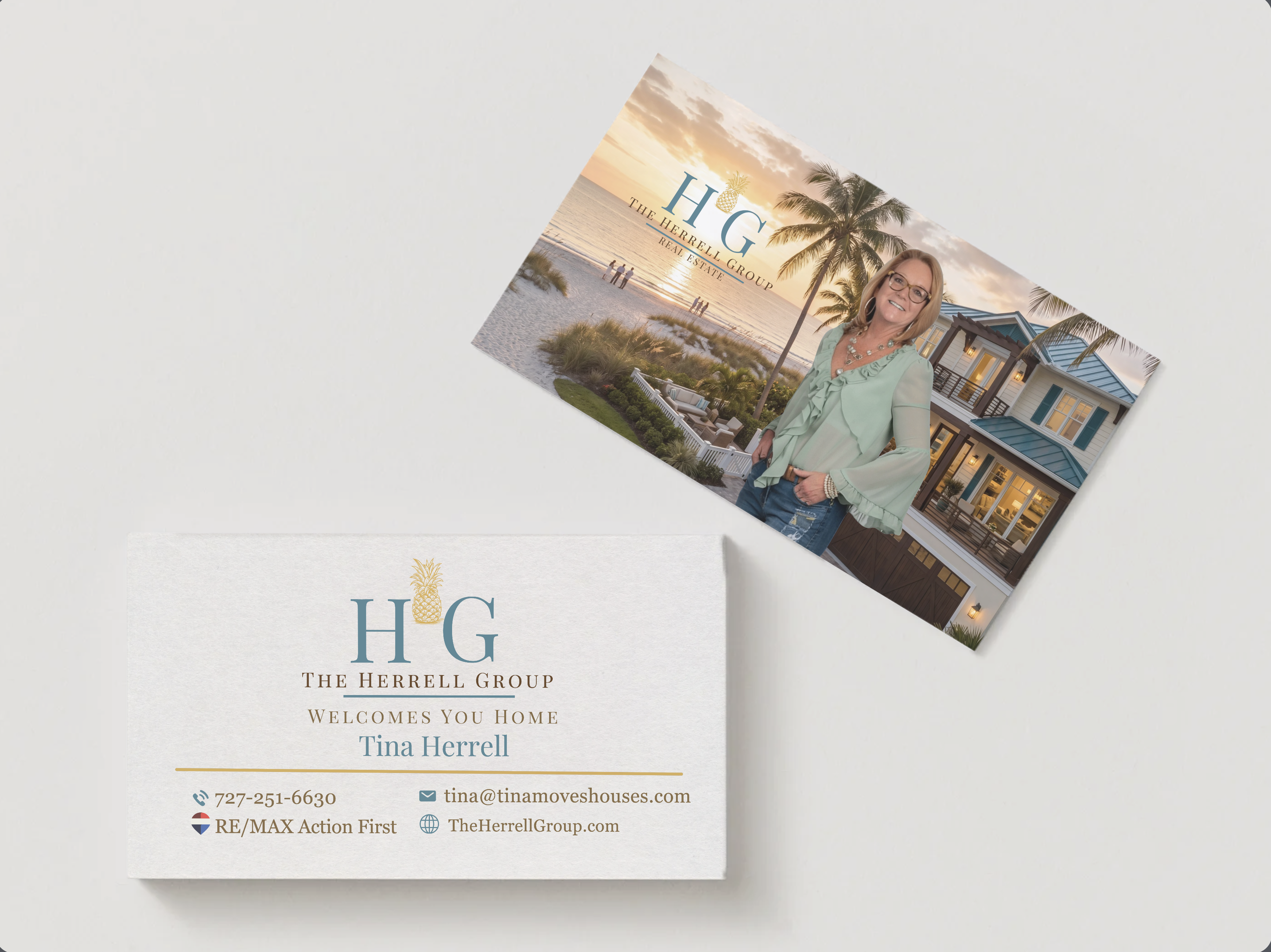 The Herrell Group business card — front with coastal photo and H·G lockup, back with contact details